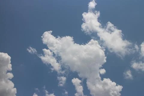 Blue sky background with tiny clouds Stock Photos