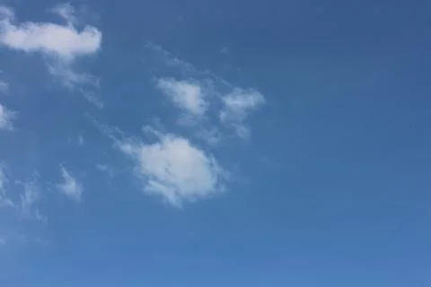 Blue sky background with tiny clouds Foto stock