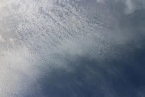 Blue sky background with tiny clouds Stock Photos