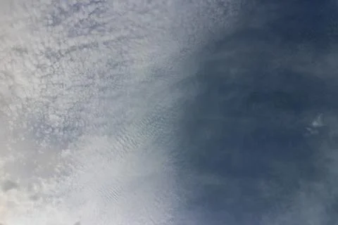 Blue sky background with tiny clouds Stock Photos