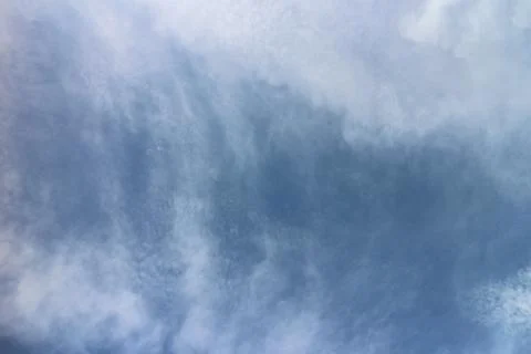 Blue sky background with tiny clouds Foto stock