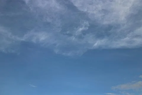 Blue sky background with tiny clouds Stock Photos