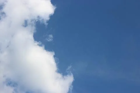 Blue sky background with tiny clouds Stock Photos