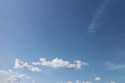 Blue sky background with tiny clouds Foto stock