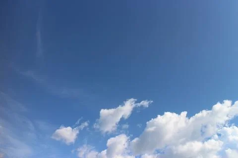 Blue sky background with tiny clouds Stock Photos