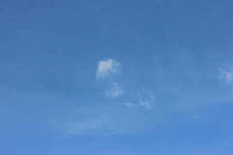 Blue sky background with tiny clouds Stock Photos