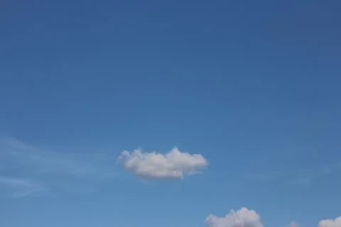 Blue sky background with tiny clouds Foto stock