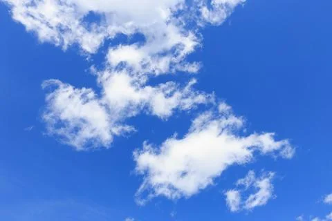 Blue sky background with tiny clouds. Stock Photos