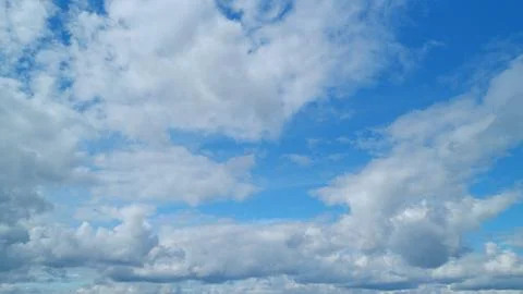 Blue sky background with tiny cumulus and cirrus fluffy on different layers Foto stock