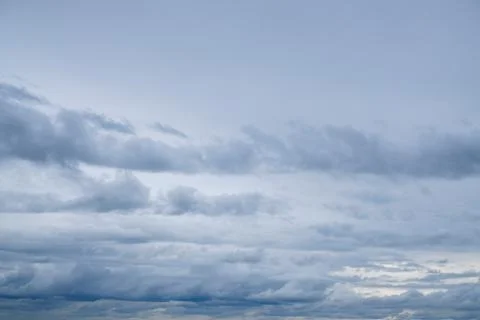Blue sky background with tiny fluffy clouds. With copy space for text Stock Photos