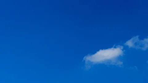 Blue sky background, white clouds and bright sunlight Stock Footage 109229663
