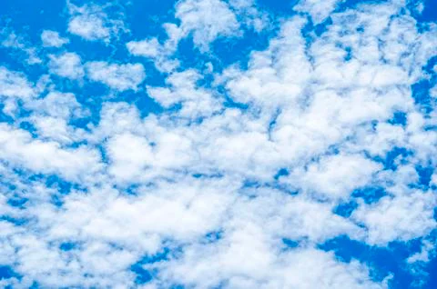 Blue sky background with white clouds Stock Photos