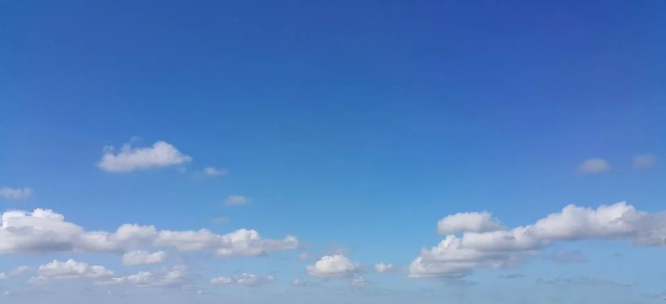 Blue sky background with white clouds Stock Photos