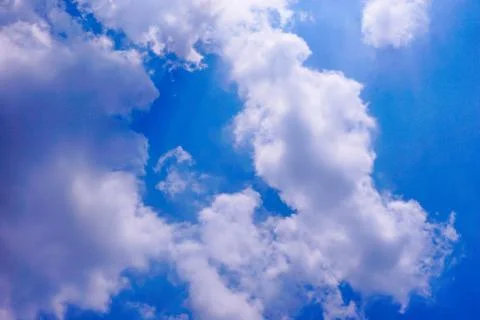 Blue sky background with white clouds  in sunny day. Stock Photos