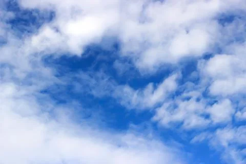 Blue sky background with white clouds Stock Photos