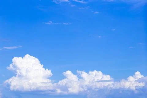 Blue sky background with white clouds, rain clouds on summer or spring day. Stockfoto's