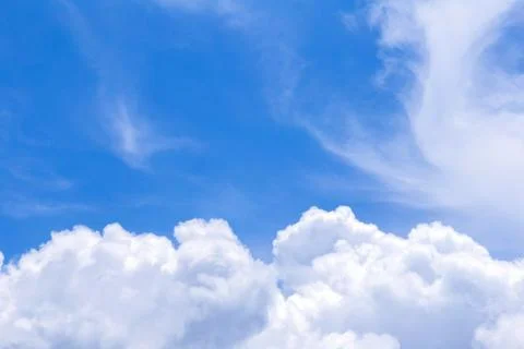 Blue sky background with white clouds, rain clouds on sunny summer or spring Stockfoto's