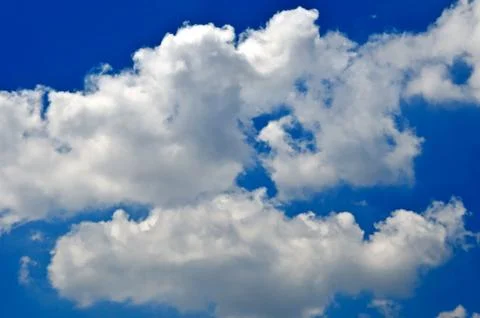 Blue sky background with white clouds Stock Photos