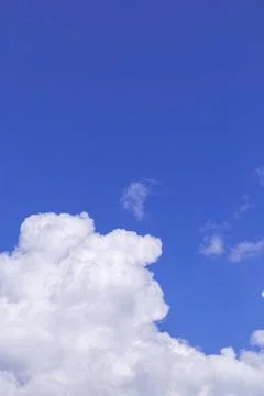Blue sky background with white clouds, rain clouds on sunny summer 写真素材