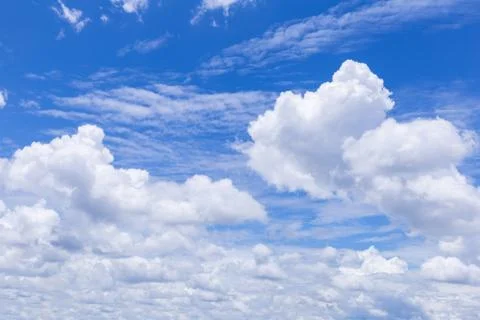 Blue sky background with white clouds, rain clouds. Stockfoto's