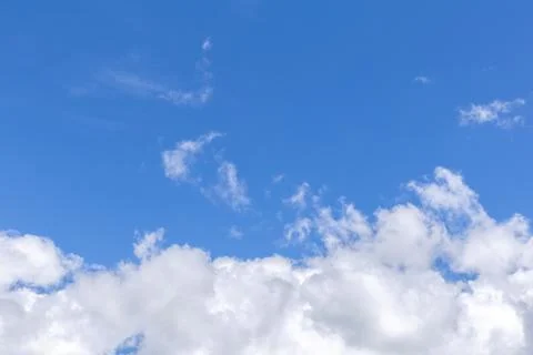 Blue sky background with white clouds, rain clouds on sunny summer day. Stock-Fotos