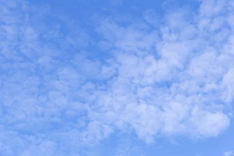 Blue sky background with white clouds, rain clouds on sunny summer day. Stock Photos