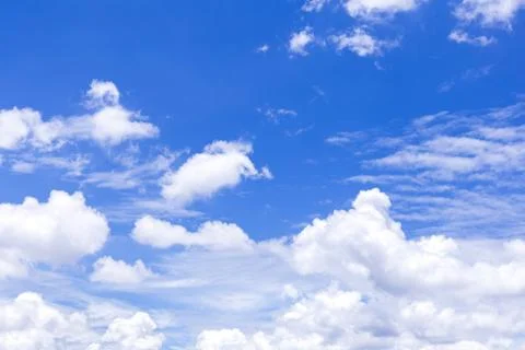 Blue sky background with white clouds, rain clouds on sunny or spring day Foto stock