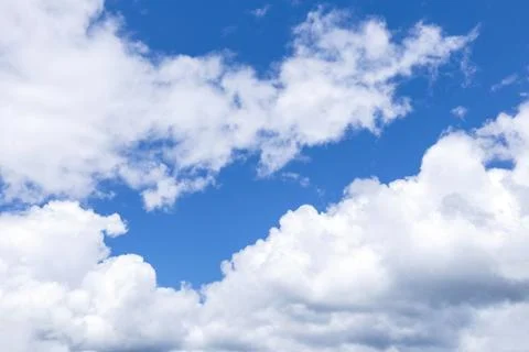 Blue sky background with white clouds, rain clouds on sunny summer or spring Foto stock