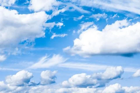 Blue sky background, white clouds and bright sunlight Stock Photos