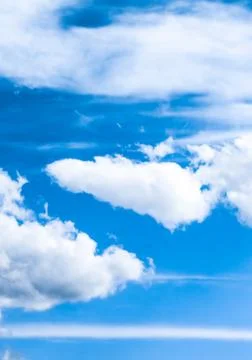 Blue sky background, white clouds and bright sunlight Stock Photos
