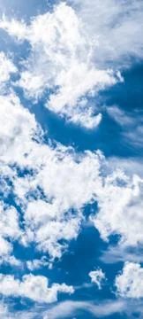 Blue sky background, white clouds and bright sunlight Stock Photos