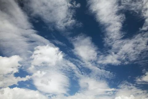 Blue sky background with white clouds Stock Photos