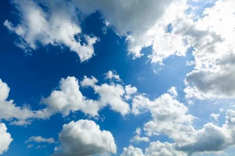 Blue sky background with white clouds in sunny day Stock Photos