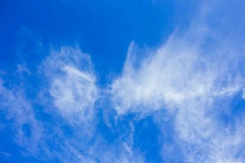 Blue sky background with white clouds. Copyspace. Stockfoto's
