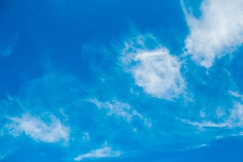 Blue sky background with white clouds. Copyspace. Stock Photos