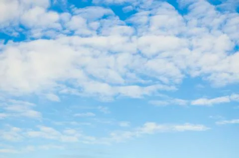 Blue sky background with white clouds Stock Photos