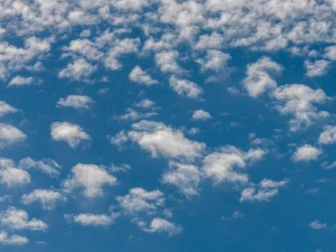 Blue sky background with white clouds. Stock Photos