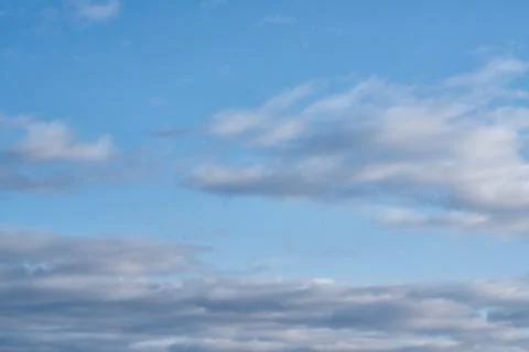Blue sky background with white clouds Фото