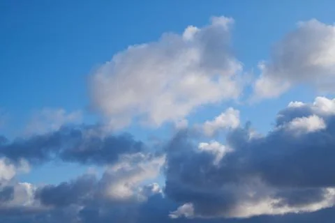 Blue sky background with white clouds. Stock Photos