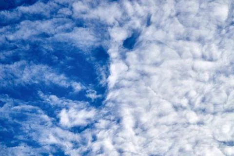 Blue sky background with white clouds Stock Photos