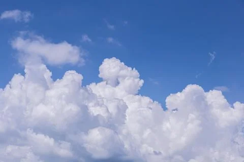 Blue sky background with white clouds on sunny day. Foto stock