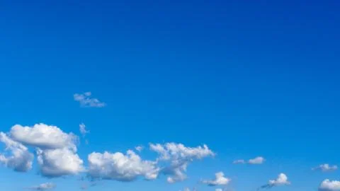 Blue sky background with white clouds. Stock Photos