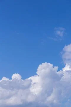 Blue sky background with white clouds on sunny day. Stock Photos