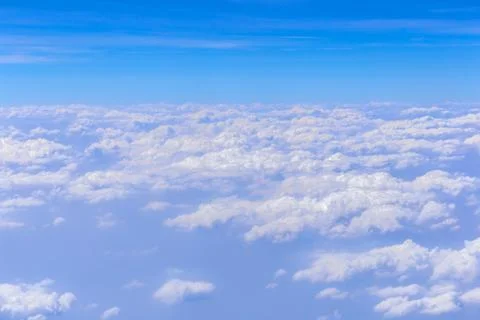 Blue sky background with white clouds on sunny day Фото