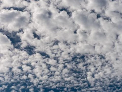 Blue sky background with white clouds. Stock Photos