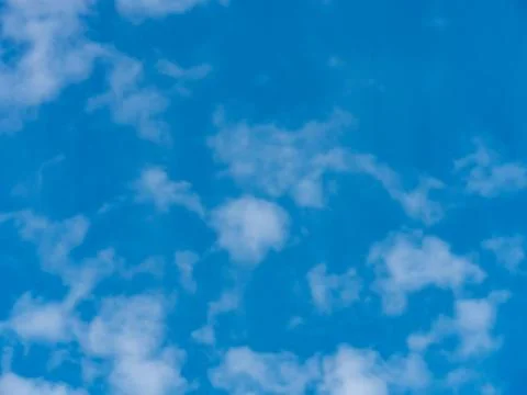Blue sky background with white clouds. Stock Photos