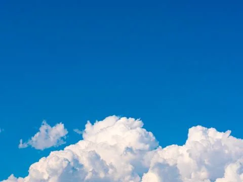 Blue sky background with white clouds. Stock Photos