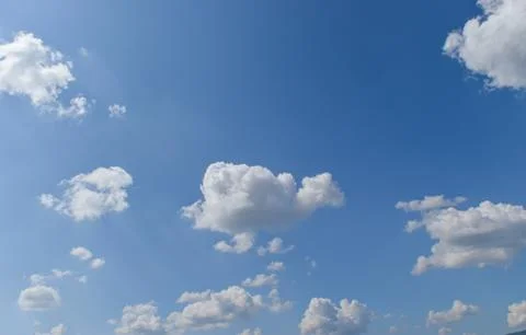 Blue sky background with white clouds. Stock Photos