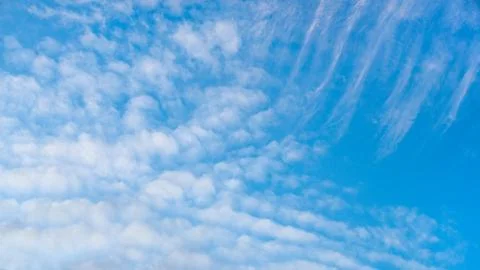 A blue sky background with white clouds Foto stock
