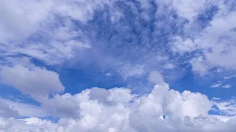 Blue sky background with white clouds on sunny day. Foto stock